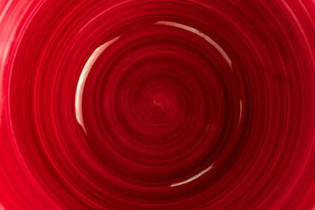 Background, ceramic plate red.Copy space.の写真素材