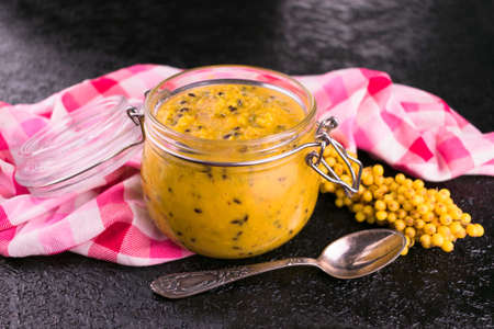 A jar with fresh sea buckthorn rubbed with honey. \ NThe concept of a healthy, vitamin-rich food.