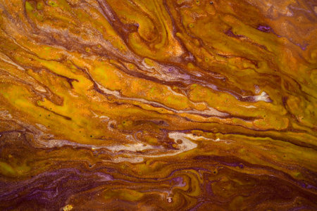 Abstract texture of mixed paints in hot yellow tones. Marble texture of stone.