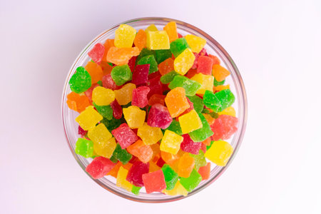Candied fruit. Dried fruits in a plate on a white background. Flat lay.の写真素材