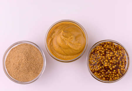 Three types of mustard on a white background. Copy space.の写真素材