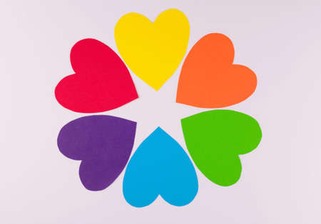 Hearts in the colors of the LGBT community flag in the form of a flower on a white background.の写真素材