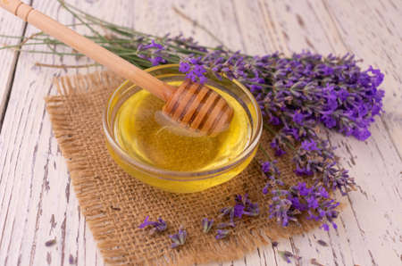 Fresh lavender honey on a white wooden old table. View from above.の写真素材