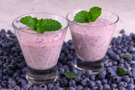 Two glasses of blueberry smoothie. Close-up.の写真素材