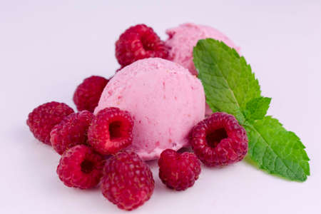 Two pink bowl of raspberry ice cream on a white background.