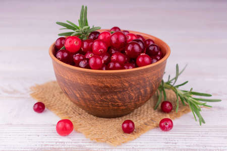 Cranberries in a bowl on a white background. Close-up.の写真素材