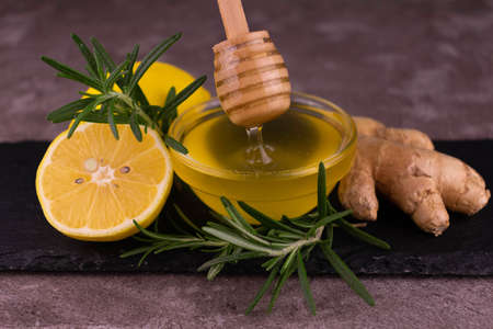 Honey, ginger, lemon and rosemary. Close-up.