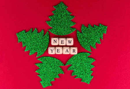Christmas background. Three shiny Christmas tree on a red background.の写真素材
