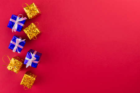 Little Gifts Red Background Christmas Background Copy Spaceの写真素材