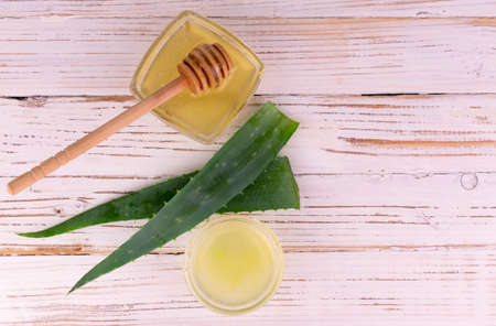 Juice Aloe Vera Leaves Honey White Wooden Background Flat Lei Copy Spaceの写真素材