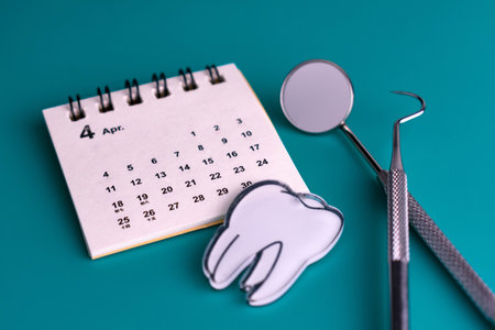 Dental Instruments Calendars Blue Background Dentist Visit Conceptの写真素材