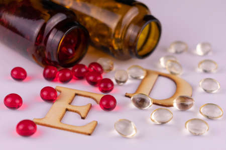 Vitamin E and Vitamin D capsules.Close-up.の写真素材