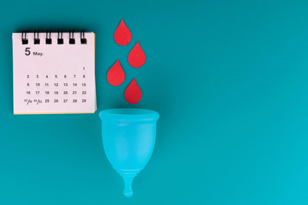 Menstrual Cup Calendar Blue Background Copy Spaceの写真素材