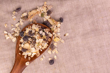 Wooden spoon with homemade granola. Copy space.の写真素材