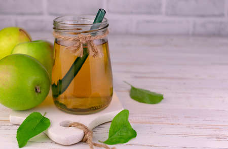 Apple juice in a jar on a white background.Copy space.