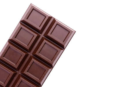 Bar of dark chocolate isolated on white background. copyspace.
