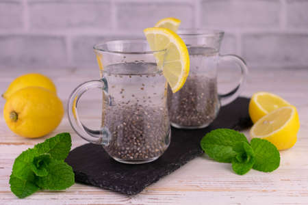 Water with lemon and chia seeds. Useful drink for weight loss and health.
