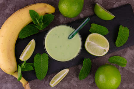 Fresh green smoothie with mint, lime and banana. flat lay.の写真素材