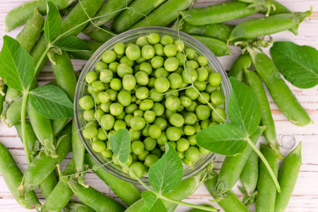 Green peas in a glass bowl. close-up. flat lay.の写真素材
