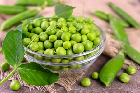 Green peas in a glass bowl.の写真素材