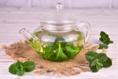 Mint tea with fresh mint leaves in a glass teapot.Close-up.の写真素材