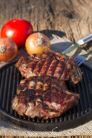 Steak on the grill. Fried meat. Fille on the frying panの写真素材