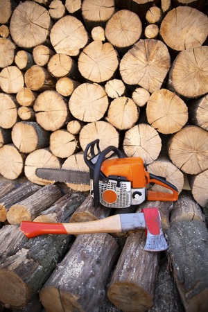 Ax in stump. Ax ready for cutting timber. Woodworking tool. Lumberjack ax in wood, chopping timber.の写真素材