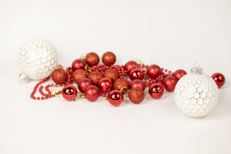 White and red Christmas balls on white backgroundの写真素材