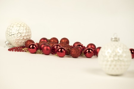 White and red Christmas balls on white backgroundの写真素材