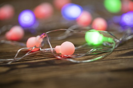 Christmas lights on dark blue background with copy space. Decorative garlandの写真素材