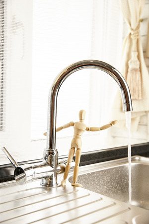 Faucet with flowing water. Concept Save Energy Water, Water Drop from Tap.の写真素材