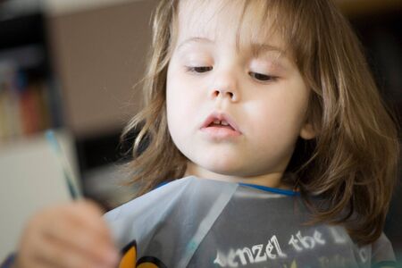 photo of a little girl while panting