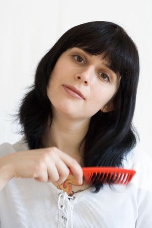 portrait of brown eyed woman with comb