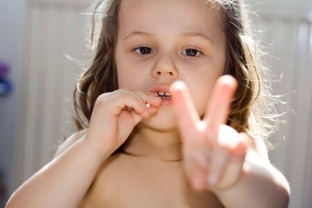 happy little girl with lollipopの写真素材