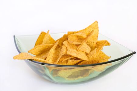 potato chips in the bowl isolated on whiteの写真素材
