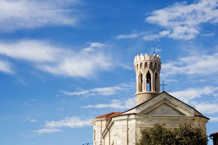Old belfry agaist the beautiful, blue skyの写真素材