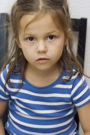 portrait of a little girl wearing striped t-shirt