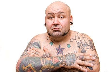 portrait of a bald man with tattoosの写真素材