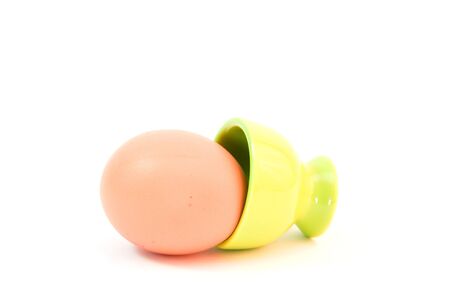 egg in eggcup isolated on white. easterの写真素材
