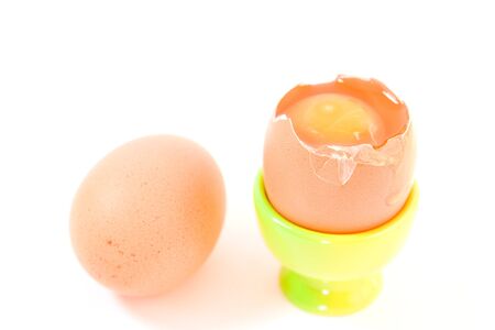 egg in green eggcup  isolated on white. easter