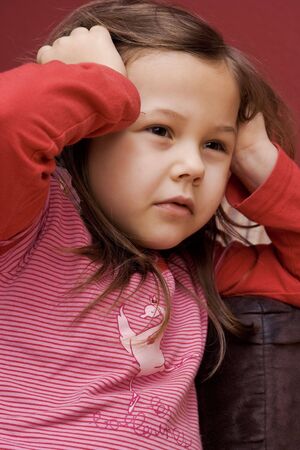 portrait of a little girl wearing striped t-shirt