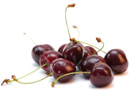 group of red cherries isolated on whiteの写真素材