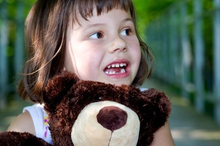 portrait of 5 years old girl  with teddy bearの写真素材