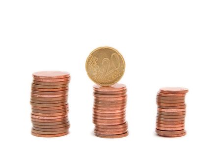 towers of golden coins isolated on white