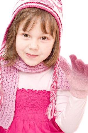little girl wearing cap and gloves isolated on whiteの写真素材