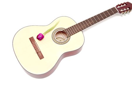 a yellow acoustic guitar isolated on whiteの写真素材