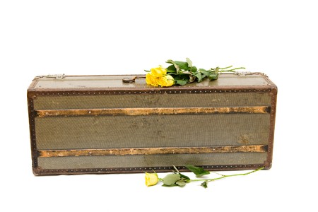 an old fashioned suitcase isolated on whiteの写真素材