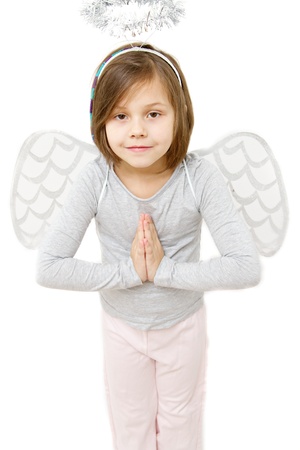 little girl dressed like angel isolated on whiteの写真素材