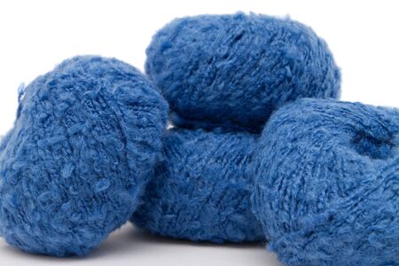the blue yarn skeins isolated on whiteの写真素材