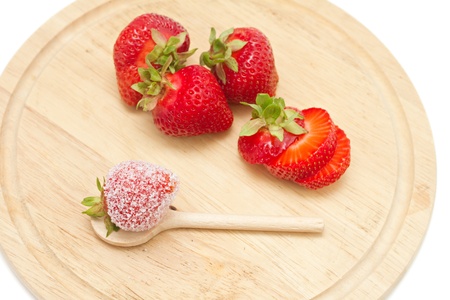 strawberries on a board isolated on whiteの写真素材
